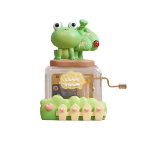 Adorable cartoon green frog hand-crank music box with a LOVE YOU cloud tag gift