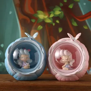 Pair of cute resin girl night lights in blue and pink for cozy bedside and desk decor