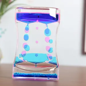 Close-up of double-colored liquid motion bubbler timer for sensory desk decor