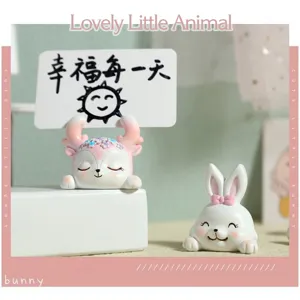 Close-up of cute cartoon resin bunny and deer memo card holder ornaments