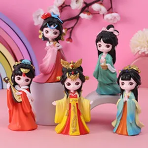 Close-up of five cute resin figurines dressed in colorful traditional Chinese Hanfu styles