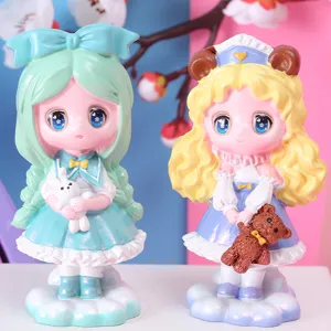 Close-up of two cute cartoon girl figurines holding a white bunny and a brown teddy bear