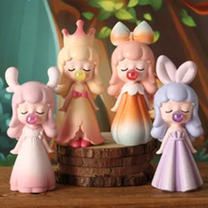 Close-up of four cute resin girl figurines blowing bubbles for desktop decoration.