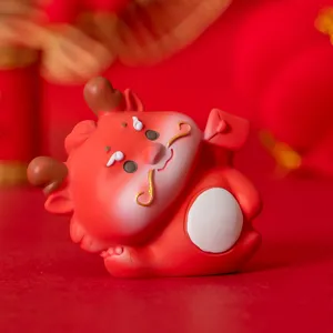 Close-up detail of a festive red Chinese New Year resin dragon figurine mascot ornament