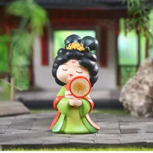 Detailed view of cute Tang Dynasty style resin girl figurine holding a round fan
