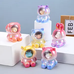 Close-up of iridescent astronaut animal figurines with a glossy pearlescent finish
