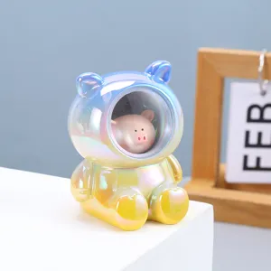 Close-up detail of a cute iridescent astronaut pig figurine for home decoration
