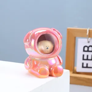 Macro shot of a pearlescent pink astronaut bear night light for bedside decoration