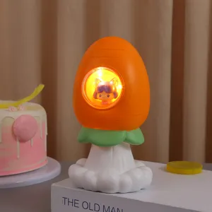 Detalle de una lámpara de resina en forma de zanahoria con una linda mini niña