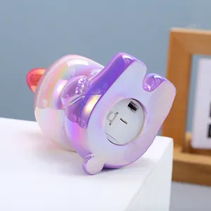 Close-up view of the battery compartment and toggle switch on the iridescent night light.