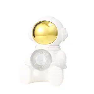 Creative astronaut night light figurine holding crystal ball for desk decoration