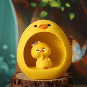 Close-up of creative cartoon yellow duck resin ornament star lamp for cute home decor.