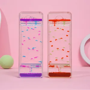 Primer plano de temporizadores de movimiento líquido bicolor con gotas de aceite en rosa