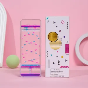 Juguete temporizador de movimiento líquido colorido con su caja de diseño geométrico.