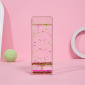 Vista detallada de un temporizador de líquido deslizante creativo rosa y verde de mesa