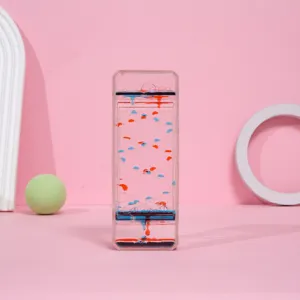 Vista detallada de un reloj de arena líquido rectangular con gotas de aceite rojas y azules