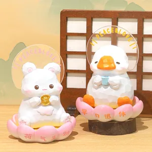 Cute Zen-style rabbit and duck figurines sitting on pink lotus bases for office decor