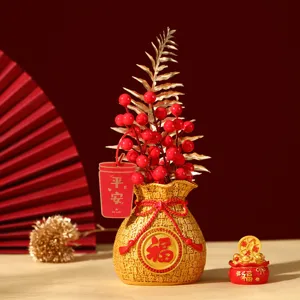 Traditional Chinese golden fortune bag ornament with red berries for home decor