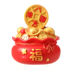 Red lucky bag money bank ornament with gold ingots and coins for wealth and prosperity