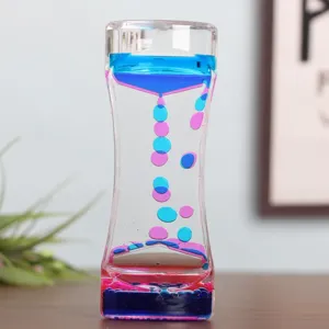 Temporizador de movimiento líquido con gotas de aceite azul y rosa en estuche de acrílico