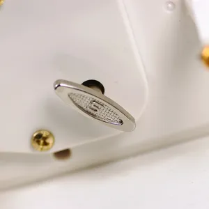 Close-up view of the mechanical winding key on a musical box base