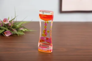 Vista detallada de un temporizador de movimiento líquido bicolor rosa y naranja