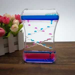 Détail d'un jouet sablier à bulles de mouvement liquide bicolore rose et bleu