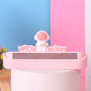 Detail of pink cartoon astronaut car temporary parking number plate with Moon Night design