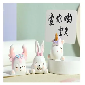 Close-up detail of cute cartoon resin memo clips featuring unicorn, rabbit and deer motifs