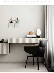 Creative resin angel girl 3D switch stickers decorating a modern home interior wall.