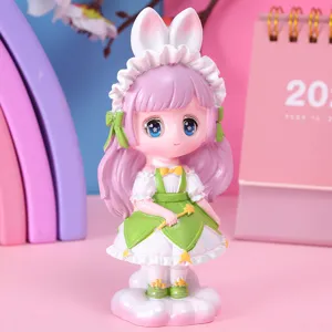 Detailed view of a cute cartoon girl figurine with pink hair, bunny ears and green dress
