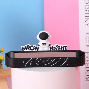 Close-up of creative astronaut car parking phone number card plate ornament in blue pink