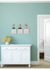 Three creative resin angel girl switch stickers shown in a stylish home interior scene