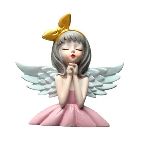 Cute resin angel girl figurine with gold bow and pink dress for home decoration