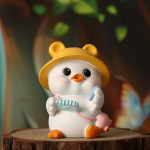 Detailed view of a cute duck figurine ornament wearing a yellow hat for home decor