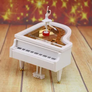 Elegant white grand piano music box featuring a rotating ballerina girl figurine gift