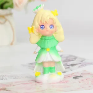 Charming anime style girl figurine wearing a green dress with cute butterfly hair clips