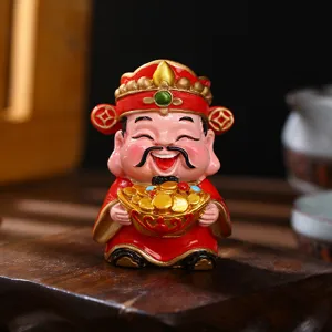 Cute red God of Wealth Caishen figurine holding gold ingots for home and office decor