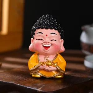 Charming mini Laughing Buddha figurine holding a gold ingot for home and office shelf decor