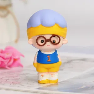 Close-up of a cute boy figurine blind box toy with blue hair and glasses decoration