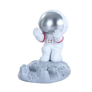 Soporte creativo para teléfono de astronauta en resina sobre base lunar adorno