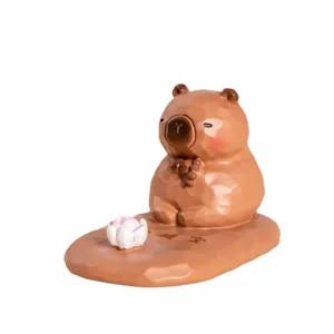 Support téléphone mignon capybara en résine avec fleur de lotus et texture géo