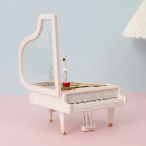 Boîte à musique élégante en forme de piano blanc avec figurine de ballerine rotative décor.