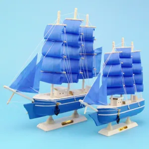 Detailed macro view of Mediterranean style blue and white wooden sailing ship model set gift