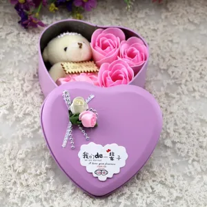 Detailed macro view of a purple heart-shaped gift tin box with soap roses and bear