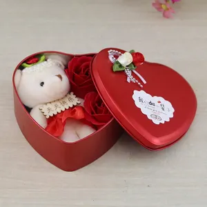 Red heart-shaped gift box featuring a cute white teddy bear and red soap roses
