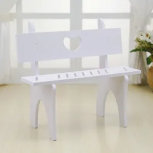 Miniature white plastic bench ornament with heart cutout for dollhouse decoration
