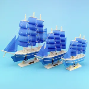 Three-piece Mediterranean style wooden sailing boat models in blue and white