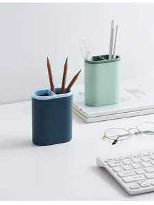 Double-compartment desktop pen holder, minimalist plastic stationery organizer for office and study use.