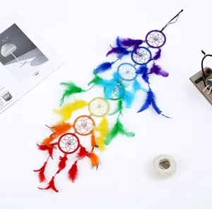 Handmade rainbow dream catcher wall hanging with colorful feathers for home decor
